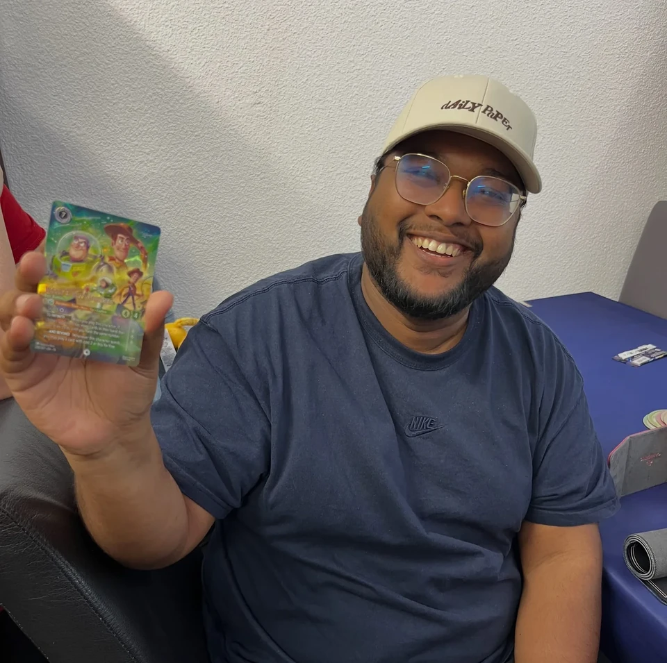 A player showing a card during a game at ShibeTCG