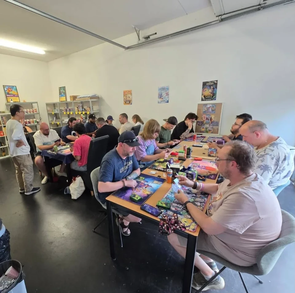 Community tables filled with card-game players at ShibeTCG